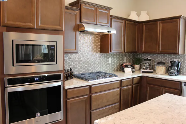a view of a hallway with paintings on the wall