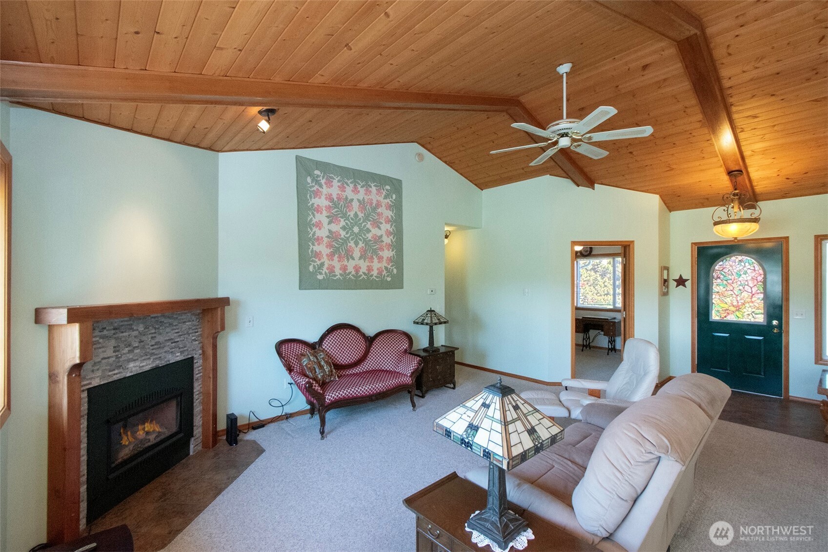 101 Timothy Lane Sequim, WA 98382 - Photo 6 of 39 a living room with furniture and a fireplace