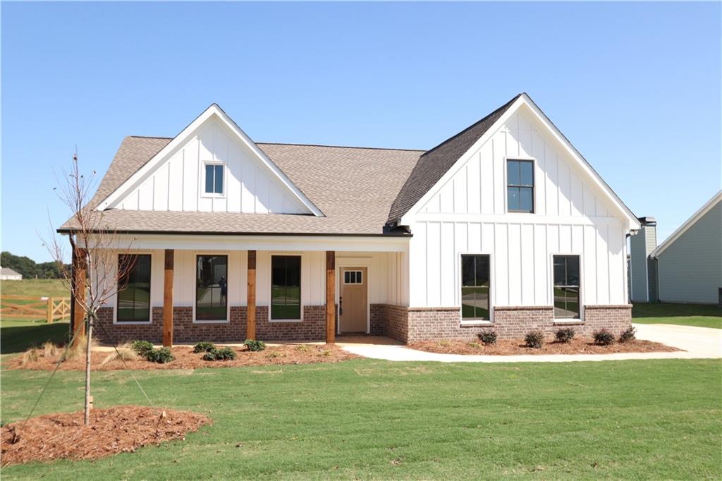 128 Perkins Road Winder, GA 30680 - Photo 1 of 1 a front view of a house with a yard