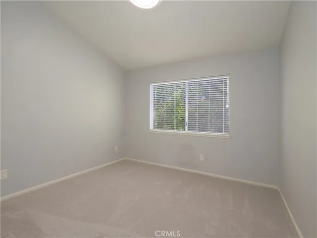 a bathroom with double vanity sink and a mirror