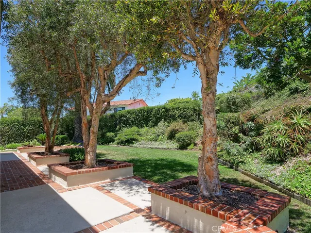 a view of a house with a backyard porch and sitting area