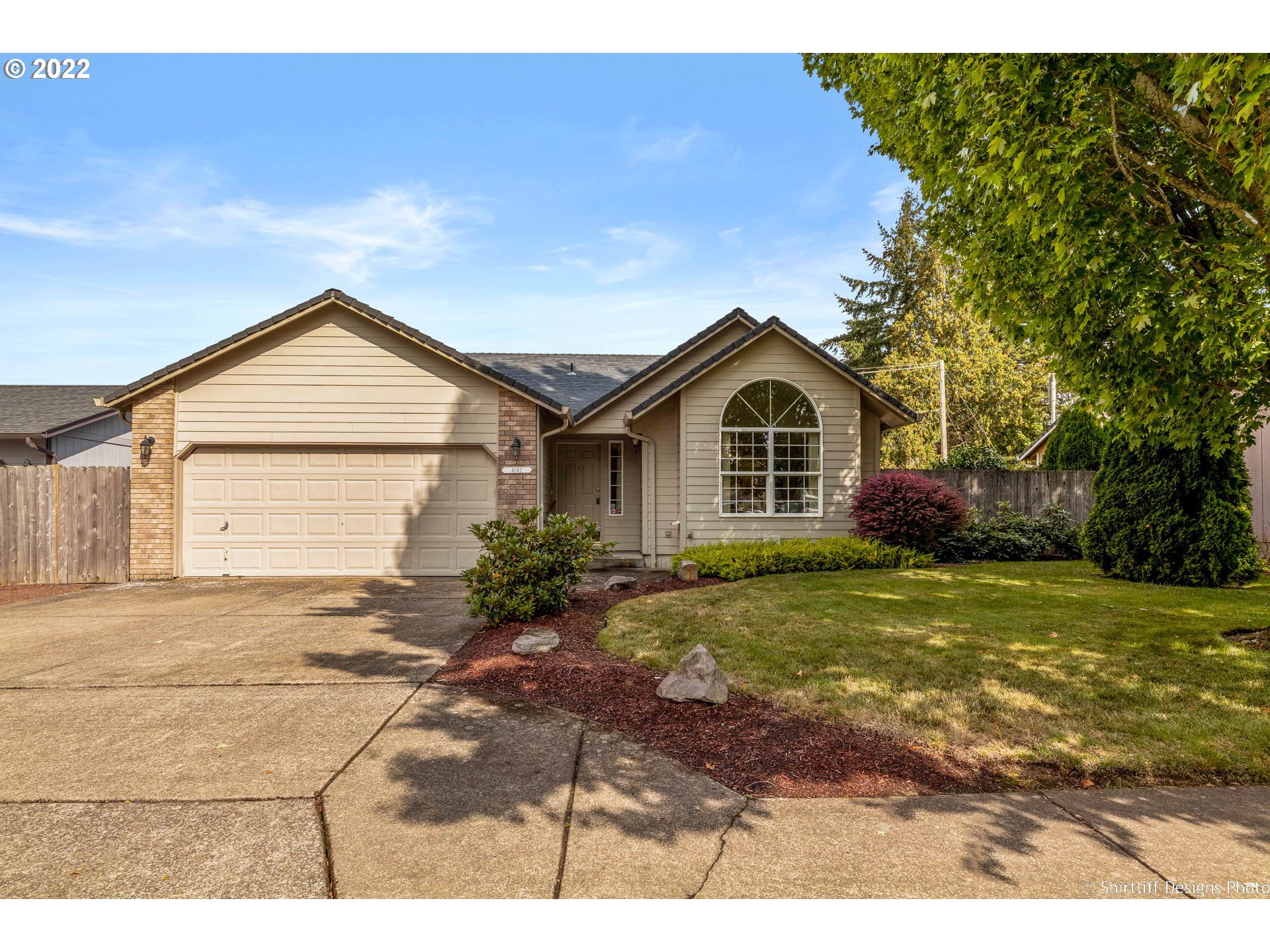 4042 Virginia Avenue Springfield, OR 97478 - Photo 1 of 28 a front view of a house with a garden