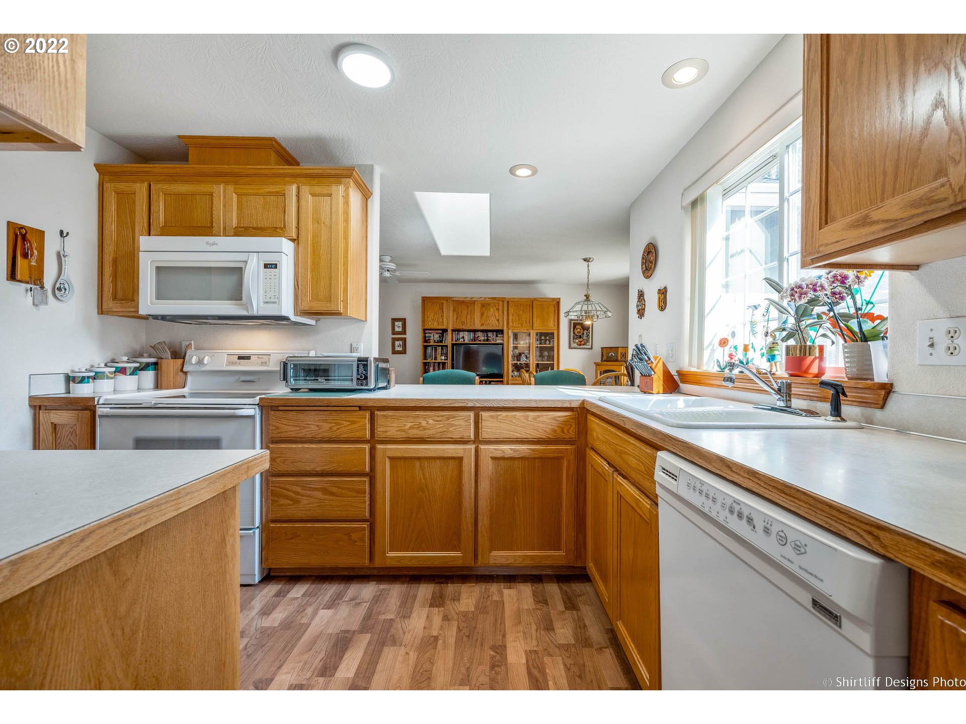 4042 Virginia Avenue Springfield, OR 97478 - Photo 7 of 28 a kitchen with stainless steel appliances granite countertop a sink stove and cabinets