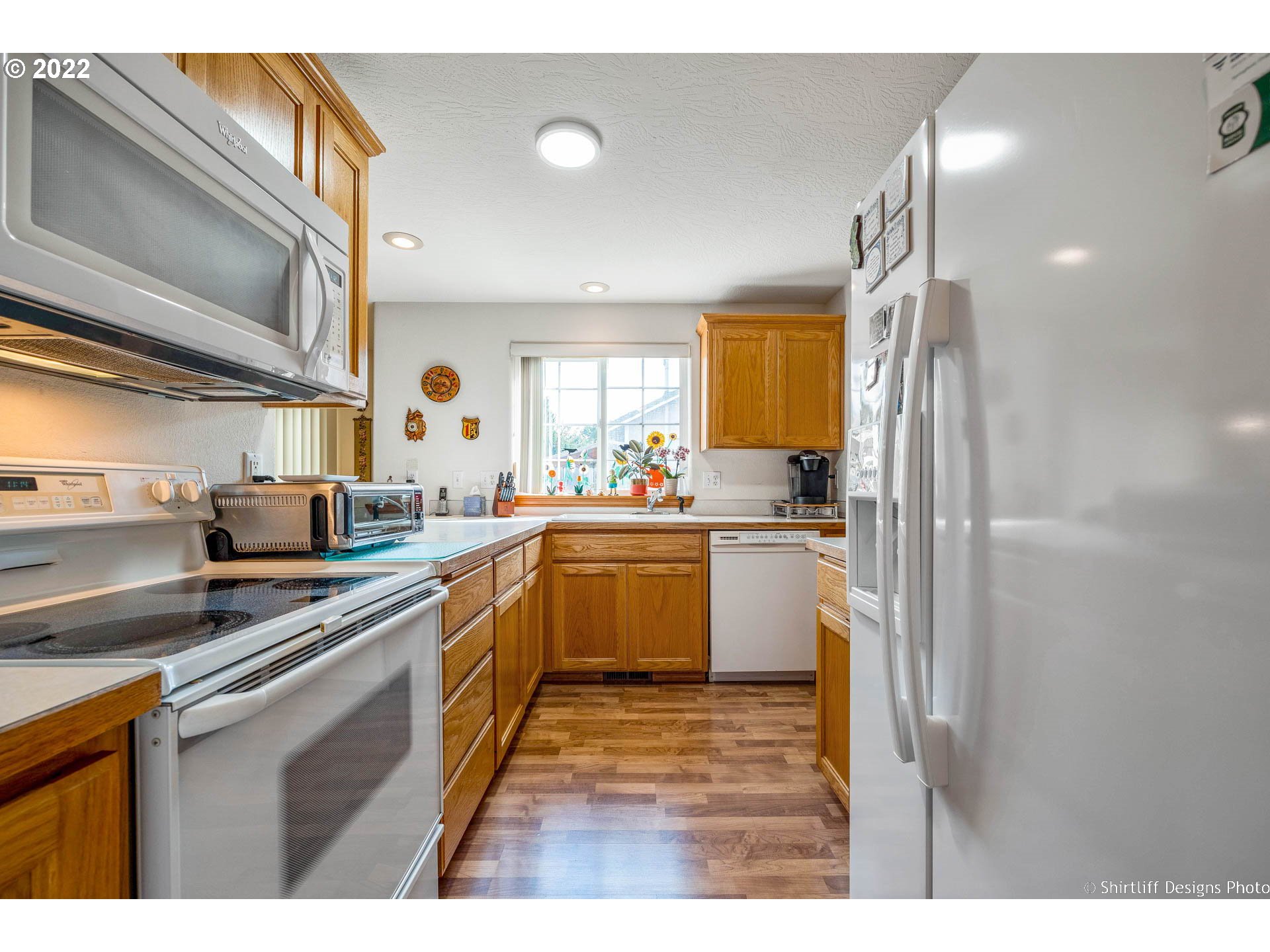 4042 Virginia Avenue Springfield, OR 97478 - Photo 8 of 28 a kitchen with sink cabinets and window
