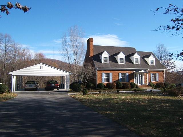 5094 Union Church Road Thaxton, VA 24174 - Photo 1 of 11 a front view of a house with a garden