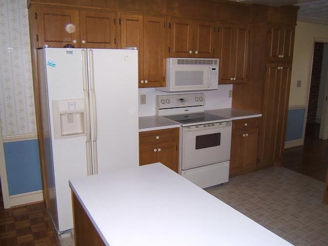 5094 Union Church Road Thaxton, VA 24174 - Photo 4 of 11 a kitchen with stainless steel appliances a refrigerator and a stove