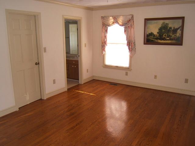 5094 Union Church Road Thaxton, VA 24174 - Photo 5 of 11 an empty room with wooden floor and windows