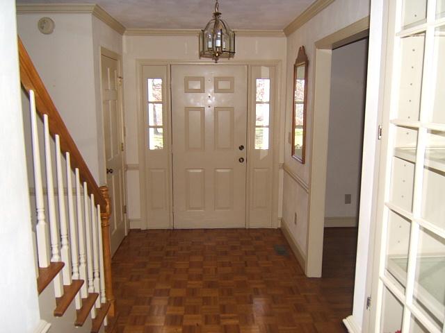 5094 Union Church Road Thaxton, VA 24174 - Photo 9 of 11 a view of a hallway with wooden floor and staircase