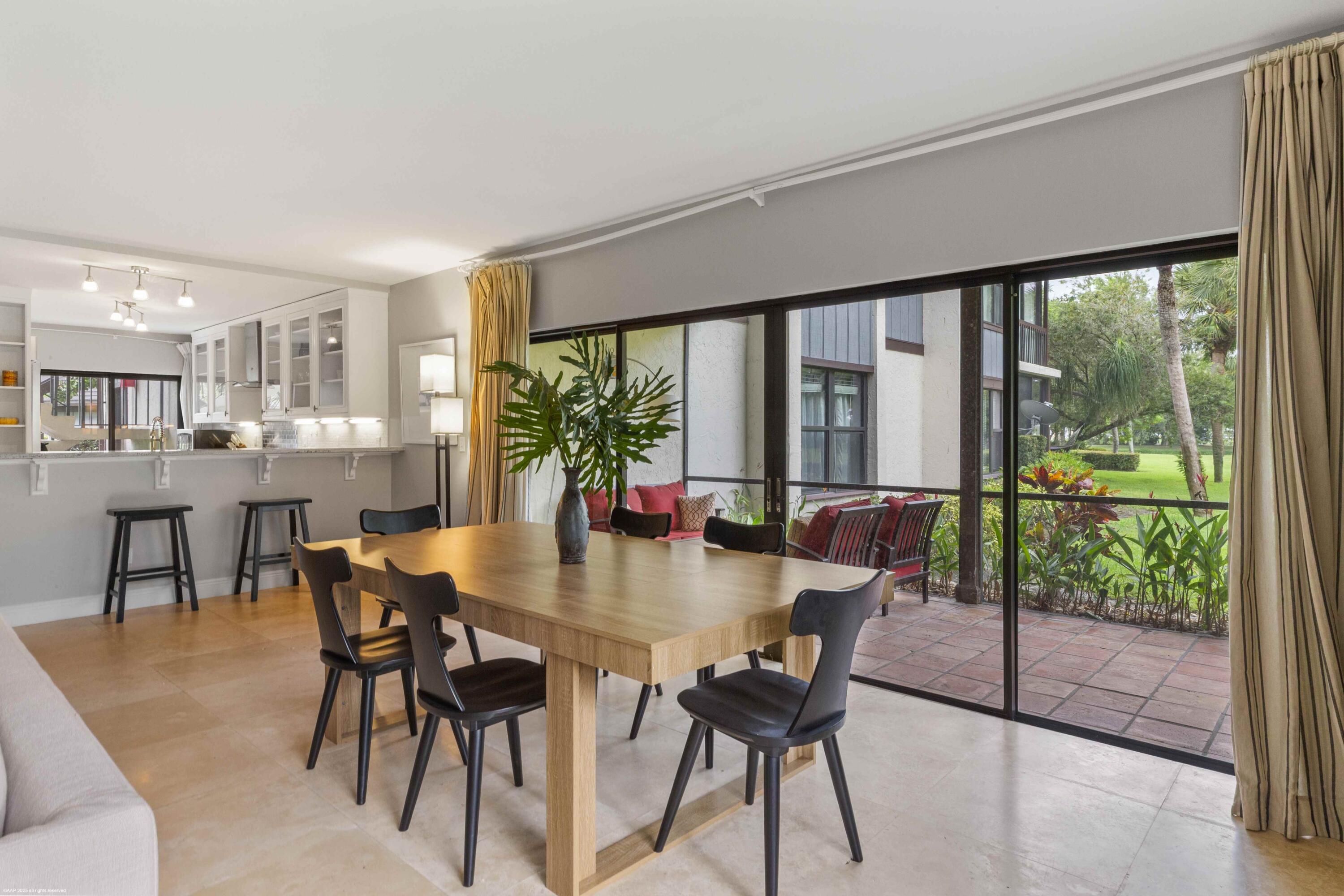 13329 Polo Club Road, Unit 105 Wellington, FL 33414 - Photo 18 of 43 a view of a dining room with furniture window and outside view