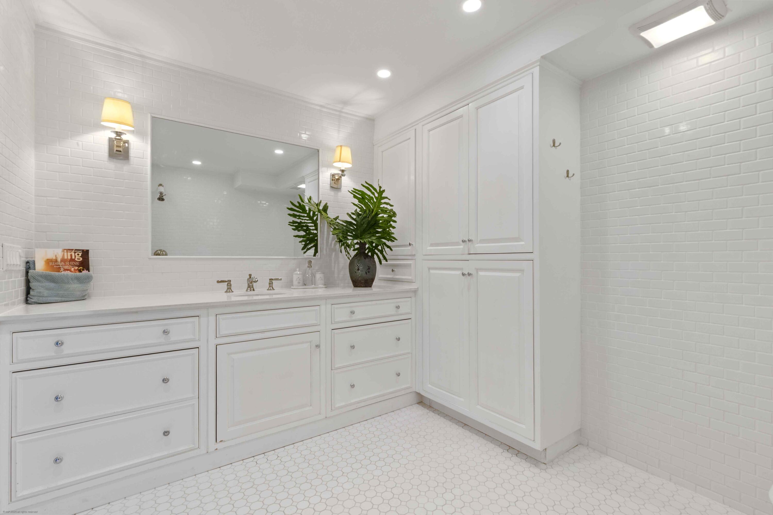 13329 Polo Club Road, Unit 105 Wellington, FL 33414 - Photo 21 of 43 a bathroom with a sink and a mirror