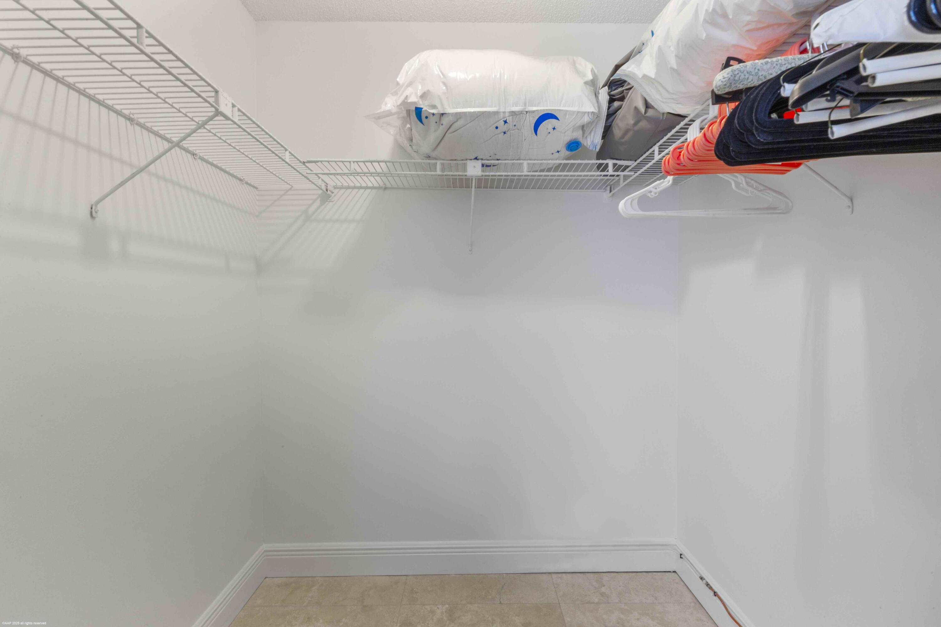 13329 Polo Club Road, Unit 105 Wellington, FL 33414 - Photo 25 of 43 a view of walk in closet