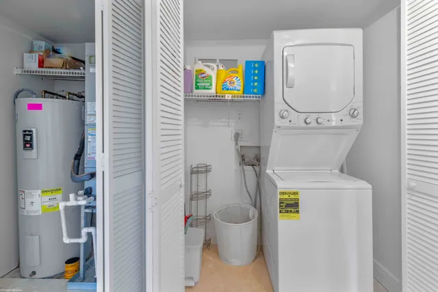 a bathroom with a toilet and a shower curtain