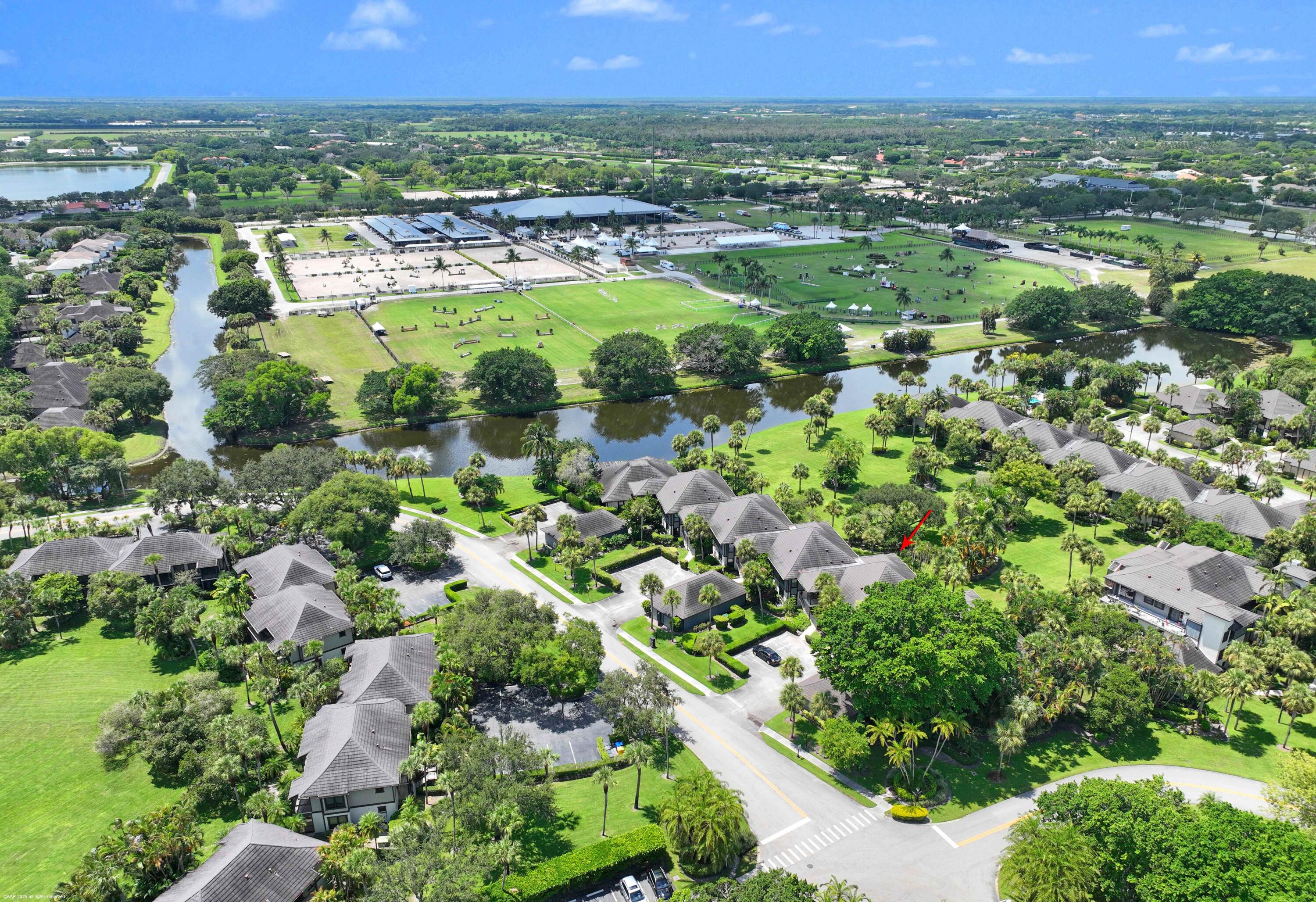 13329 Polo Club Road, Unit 105 Wellington, FL 33414 - Photo 4 of 43 an aerial view of residential houses with outdoor space and trees