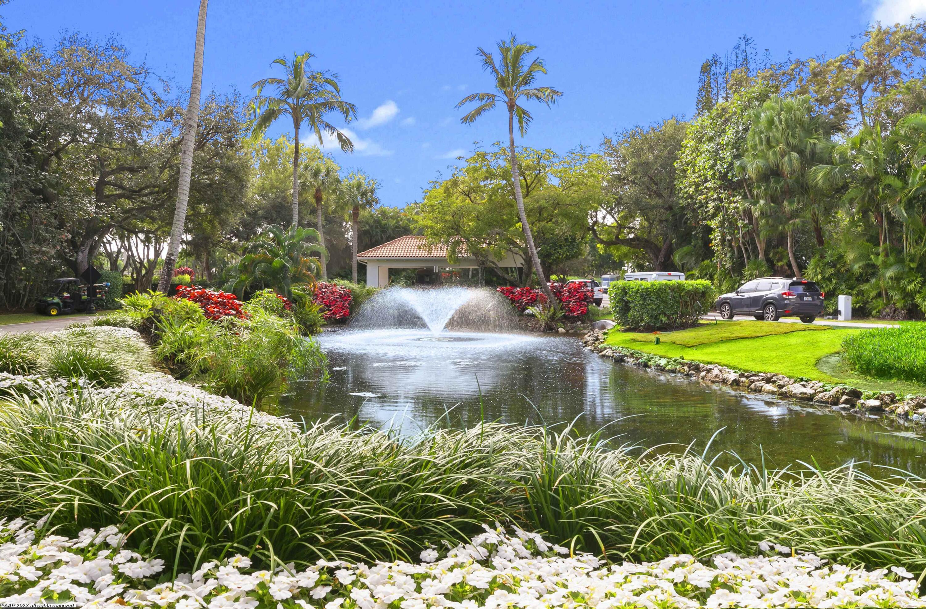 13329 Polo Club Road, Unit 105 Wellington, FL 33414 - Photo 42 of 43 a view of a garden with a fountain
