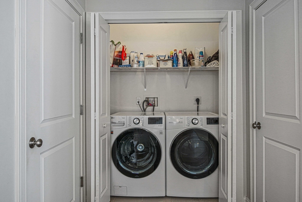 831 Ledgewood Way, Unit 831 Clinton, MA 01510 - Photo 24 of 41 a utility room with dryer and washer