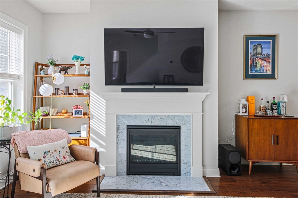 831 Ledgewood Way, Unit 831 Clinton, MA 01510 - Photo 32 of 41 a living room with furniture and a fireplace