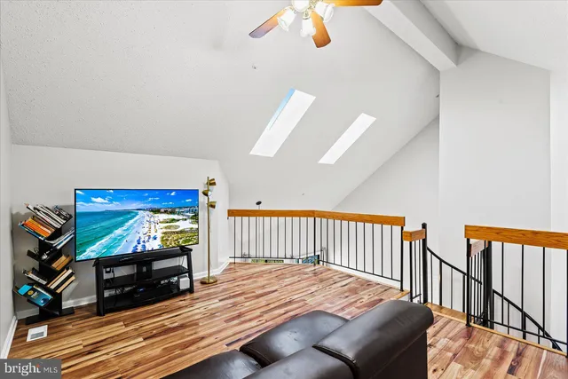 a bedroom with furniture and a flat screen tv
