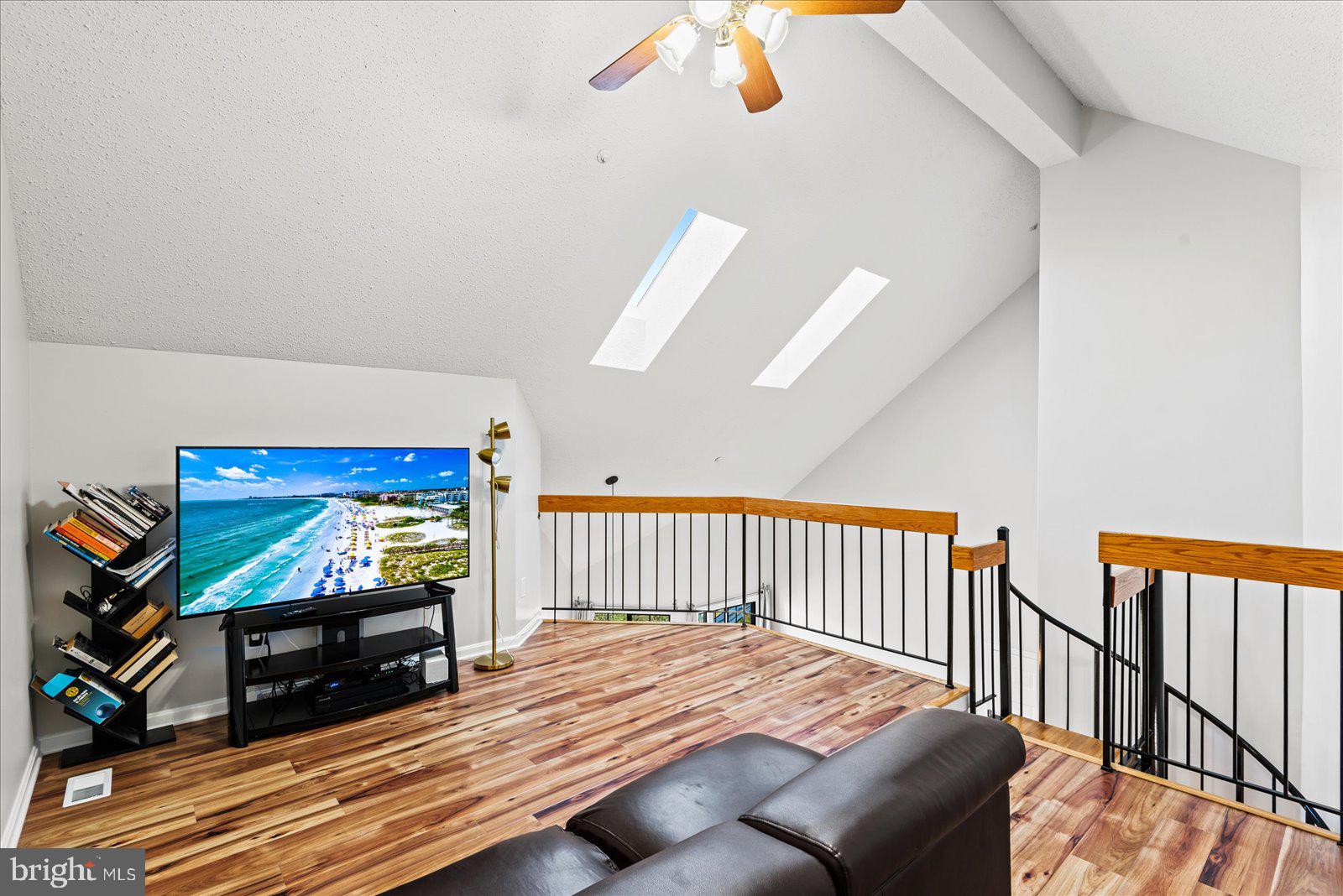 6000 F Mersey Oaks Way, Unit 1F Alexandria, VA 22315 - Photo 23 of 35 a bedroom with furniture and a flat screen tv