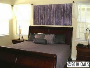 8152 Evanston Falls Road Huntersville, NC 28078 - Photo 6 of 8 a bedroom with a bed and a window