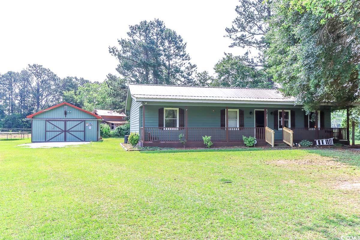 3150 Dusty Road Loris, SC 29569 - Photo 1 of 29 View of front facade featuring a porch, a front la