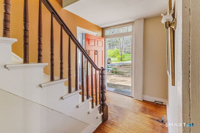 760 Upper Maple Street Killingly, CT 06239 - Photo 8 of 34 a view of entryway and hall with wooden floor