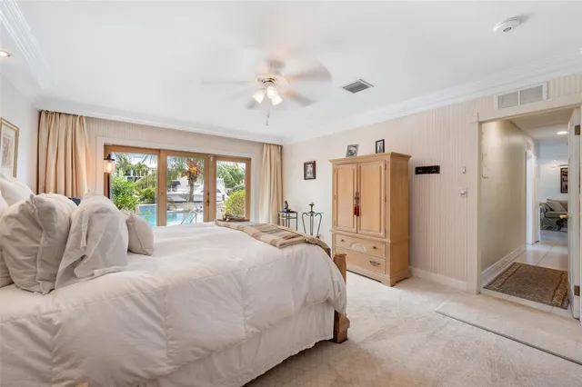 a spacious bedroom with a bed and a couch