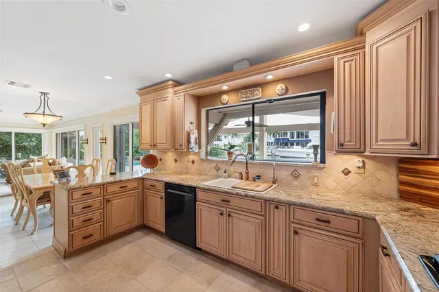a kitchen with microwave cabinets and refrigerator