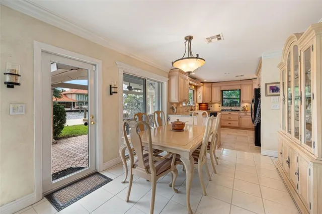 a living room with furniture a ceiling fan and a rug