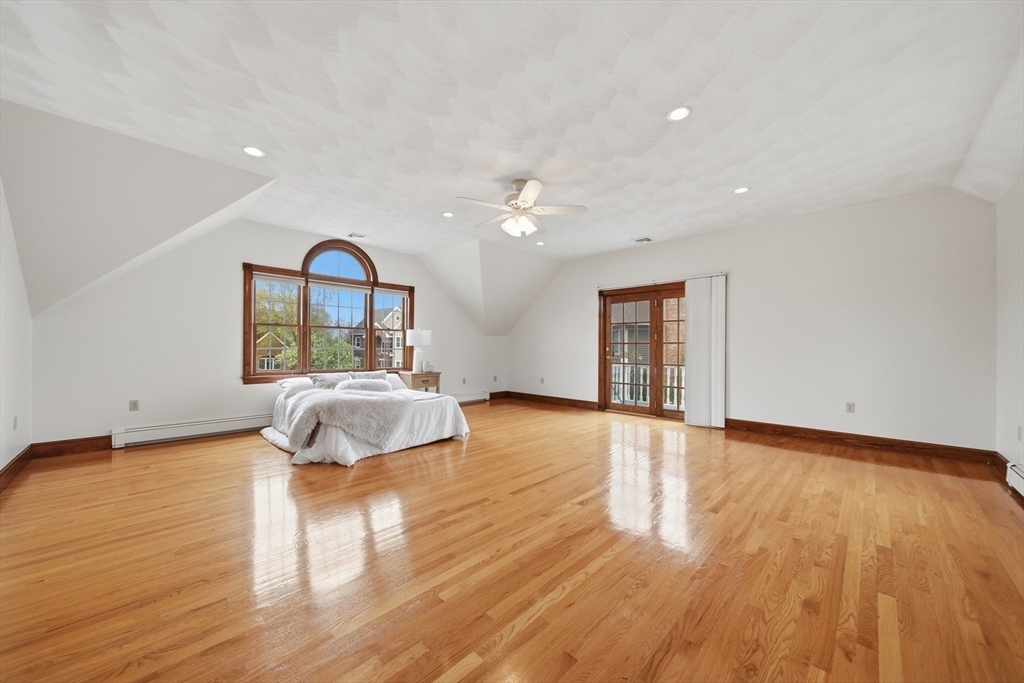 131 Range Heights Road Lynn, MA 01904 - Photo 16 of 36 a bedroom with wooden floor and a window