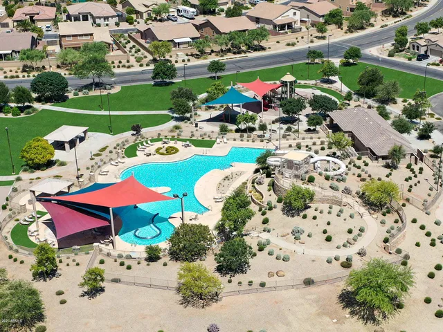 an aerial view of a swimming pool and outdoor space