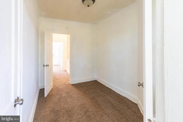a view of a livingroom and entryway
