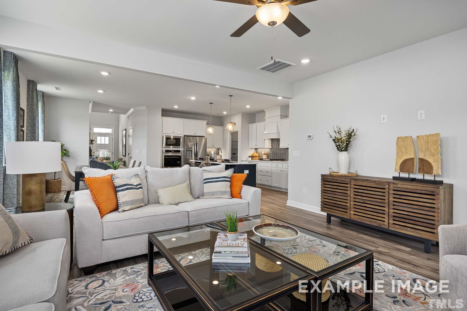170 Rigsby Avenue Four Oaks, NC 27524 - Photo 18 of 39 a living room with furniture and a view of kitchen
