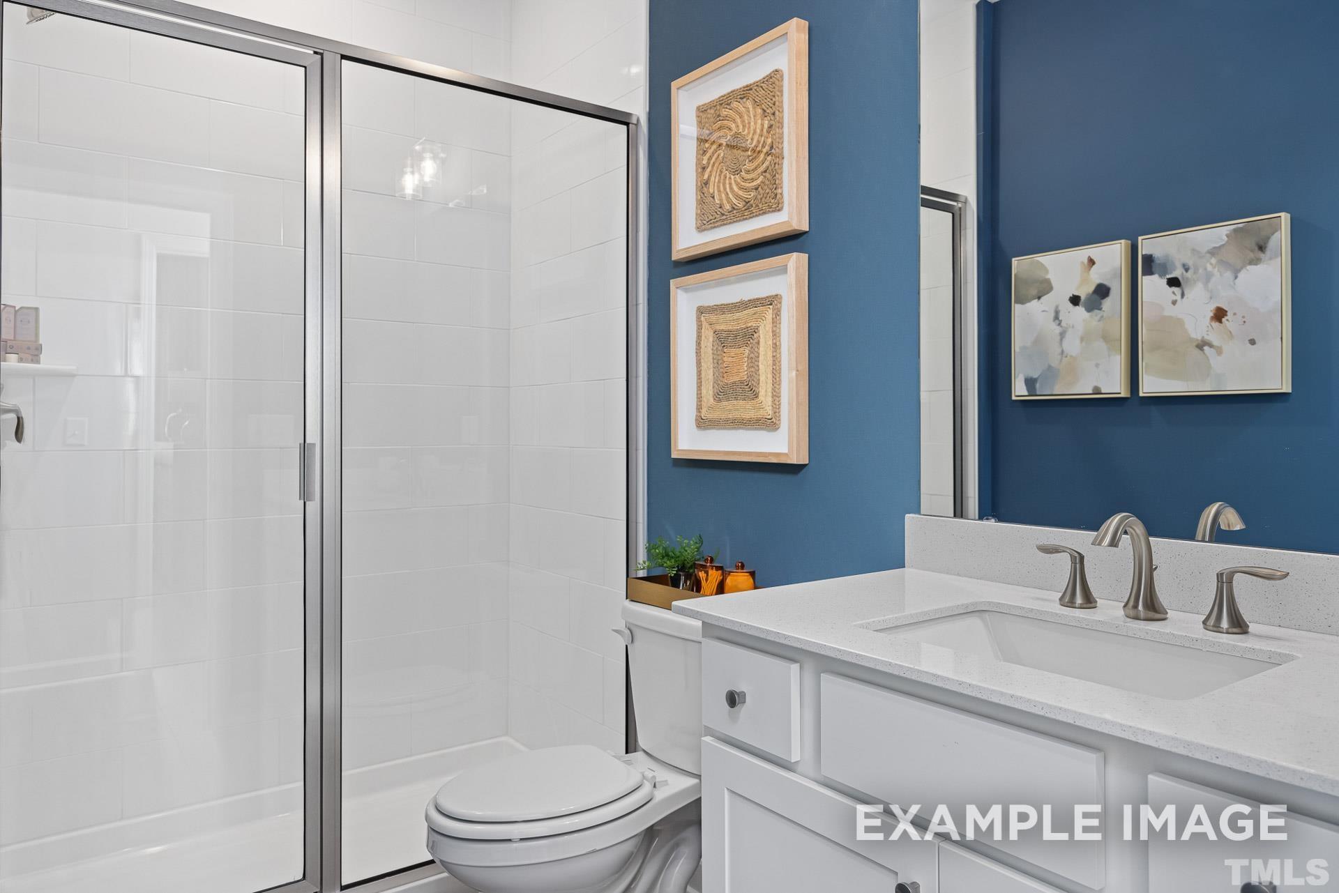 170 Rigsby Avenue Four Oaks, NC 27524 - Photo 19 of 39 a bathroom with a granite countertop sink toilet and shower