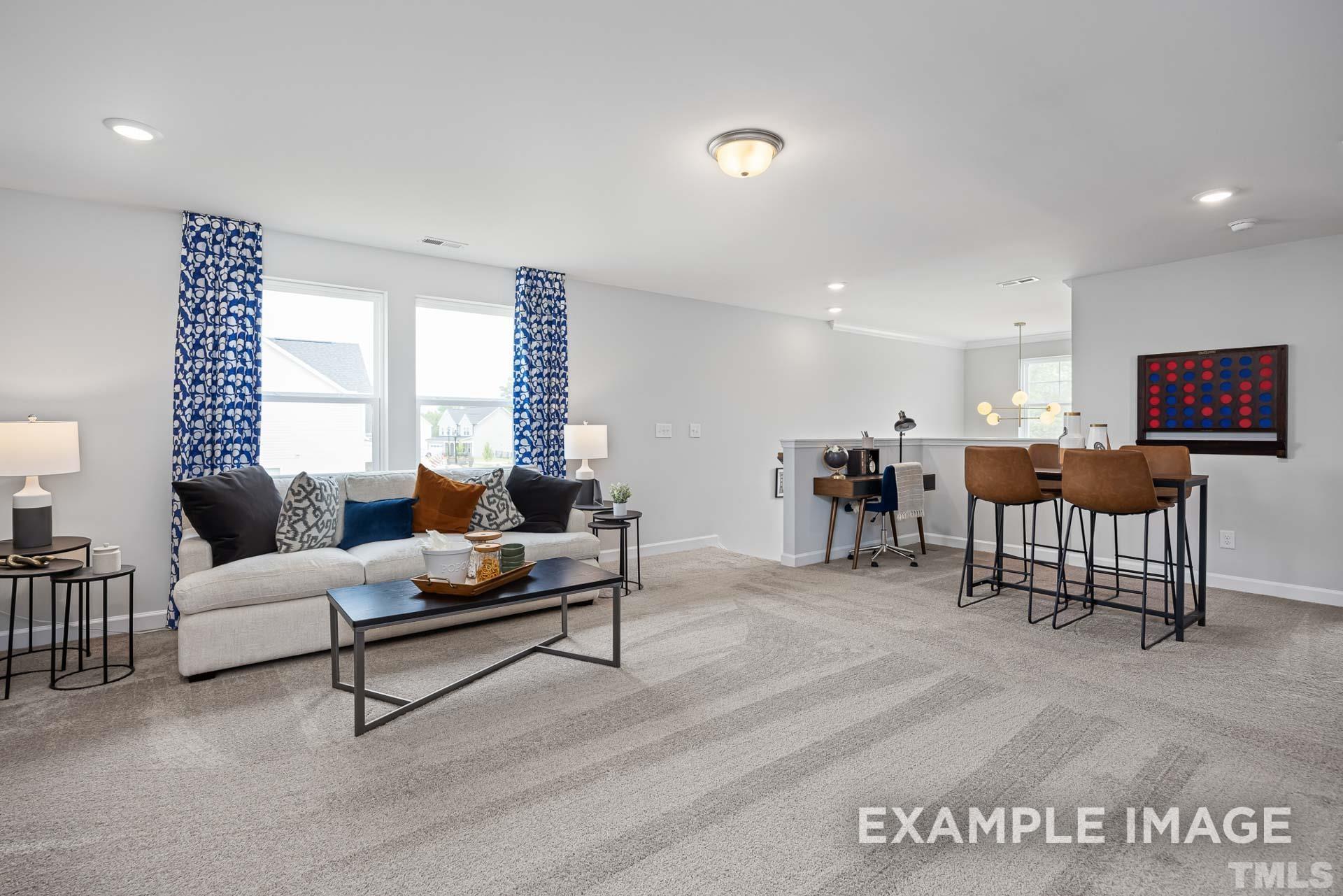 170 Rigsby Avenue Four Oaks, NC 27524 - Photo 23 of 39 a living room with furniture and a table