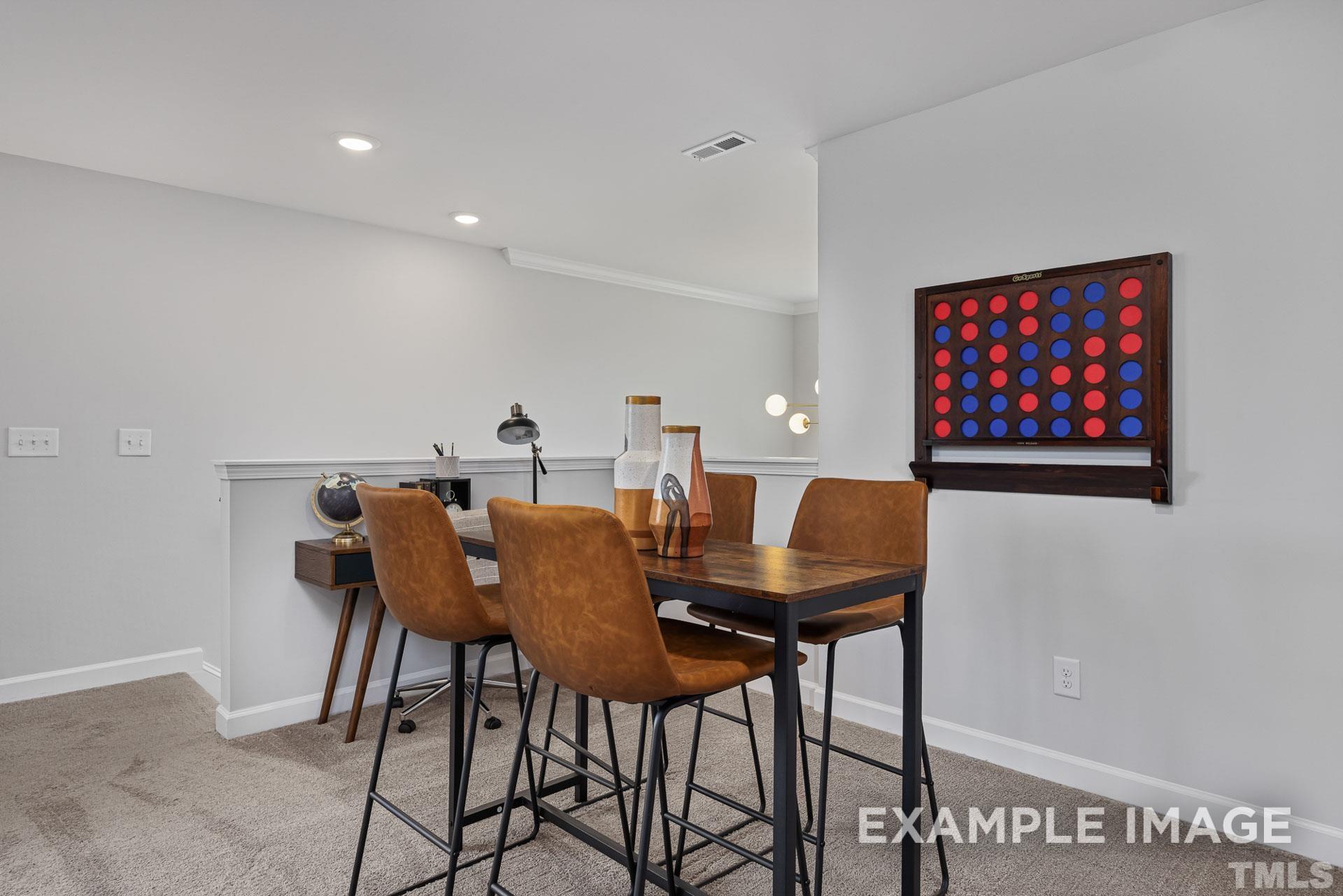 170 Rigsby Avenue Four Oaks, NC 27524 - Photo 24 of 39 a view of a dining room with furniture and wooden floor