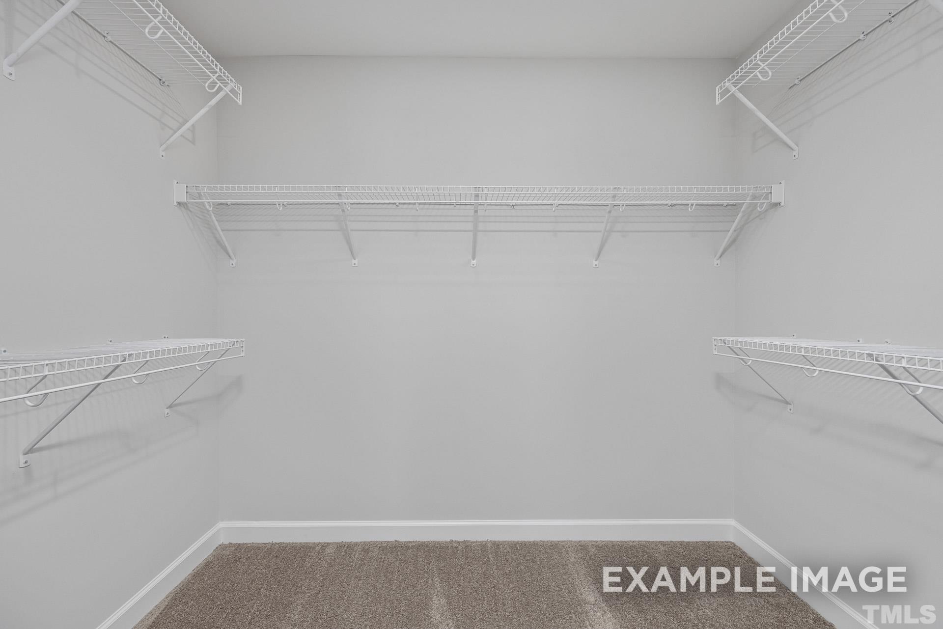 170 Rigsby Avenue Four Oaks, NC 27524 - Photo 31 of 39 a view of a room with racks on the wall