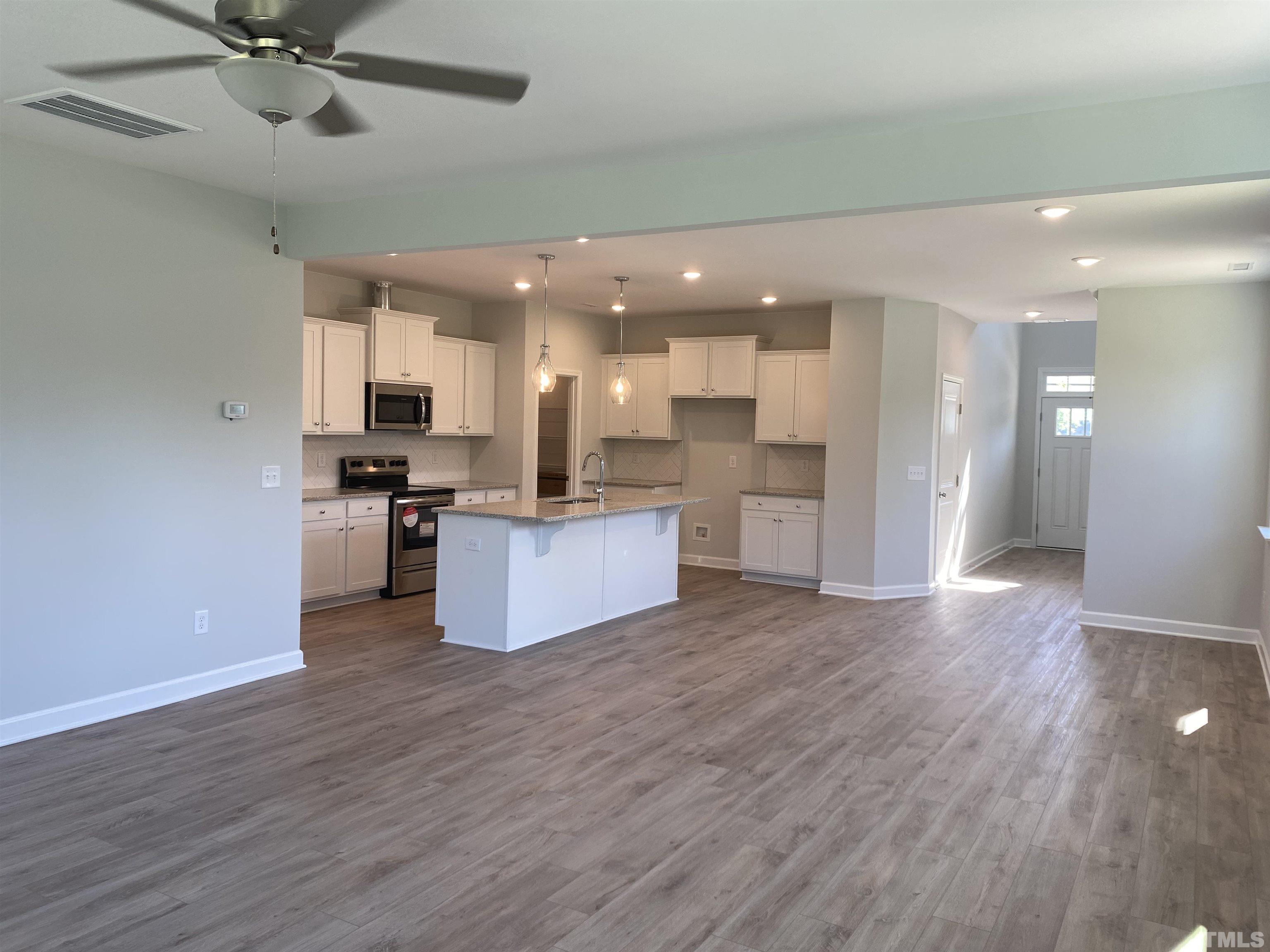 170 Rigsby Avenue Four Oaks, NC 27524 - Photo 4 of 39 a view of kitchen with cabinets microwave and stove