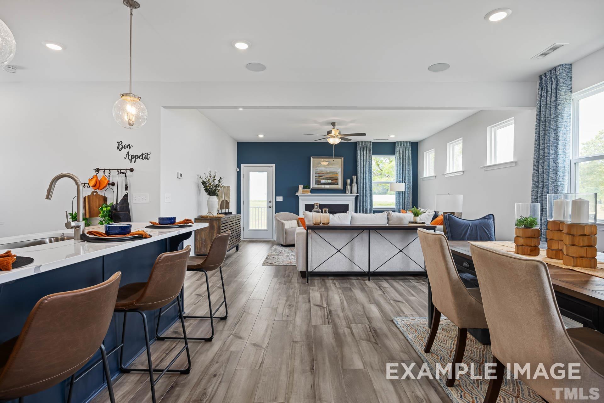 170 Rigsby Avenue Four Oaks, NC 27524 - Photo 7 of 39 a view of a dining room with furniture and wooden floor
