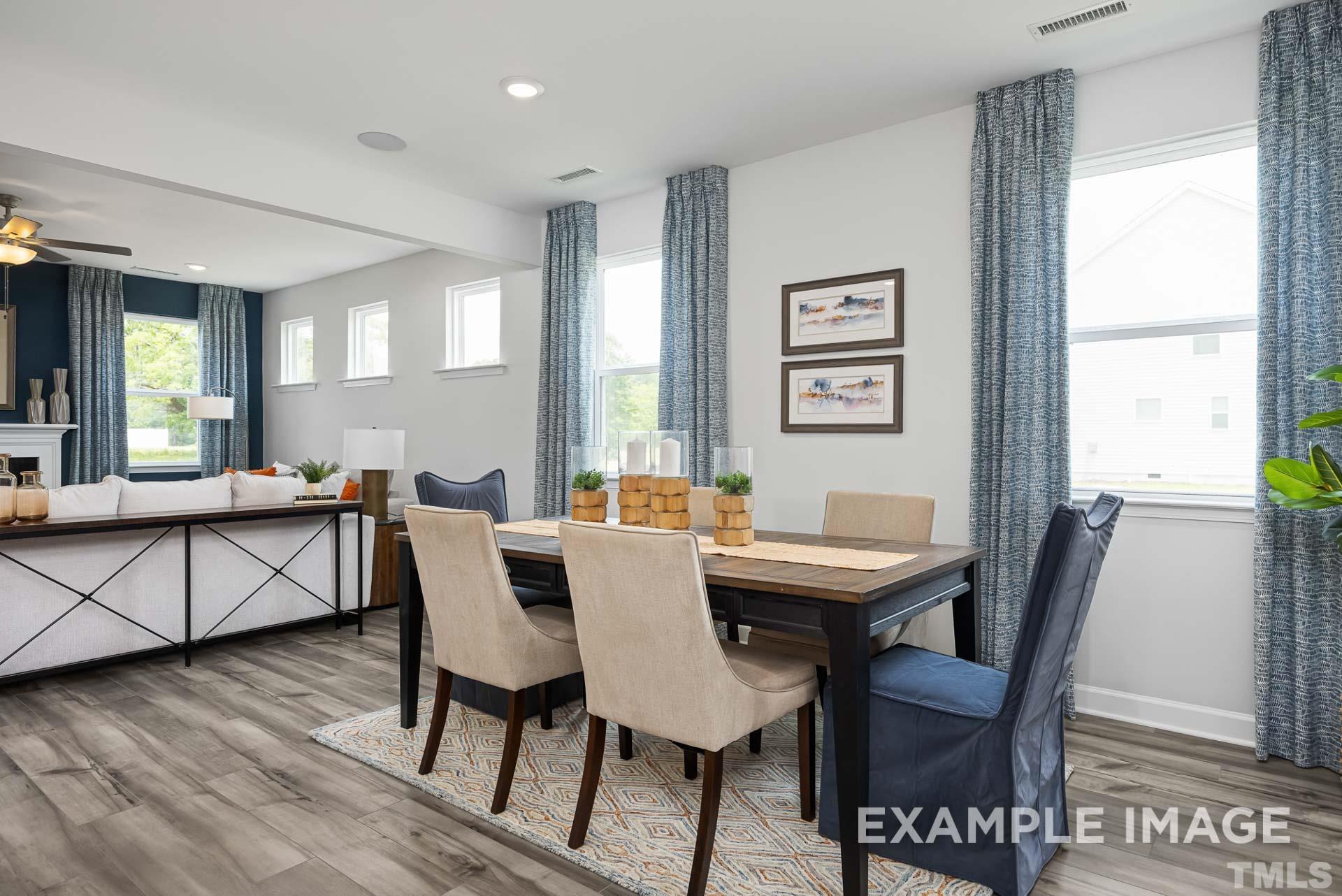 170 Rigsby Avenue Four Oaks, NC 27524 - Photo 8 of 39 a view of a dining room with furniture window and wooden floor