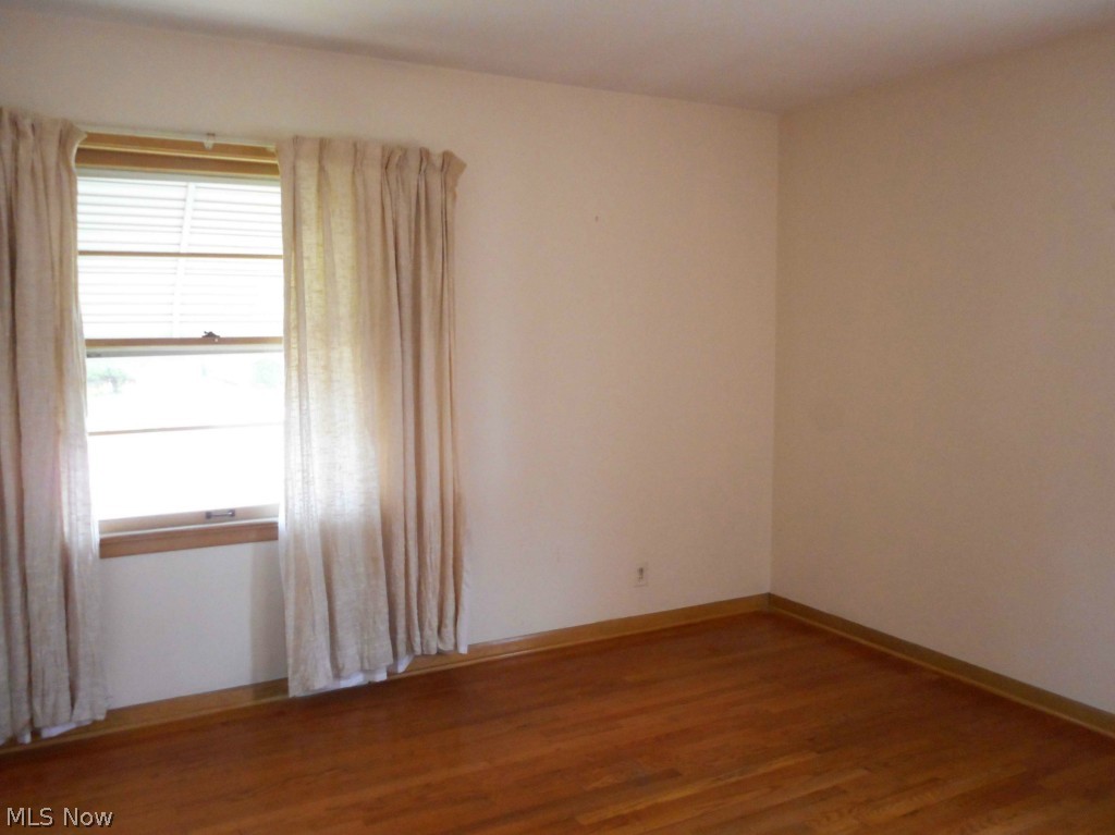 12311 Orme Road Garfield Heights, OH 44125 - Photo 6 of 12 One of 3 Spacious Bedrooms with Gleaming Wood Floors and Great Closet Space.