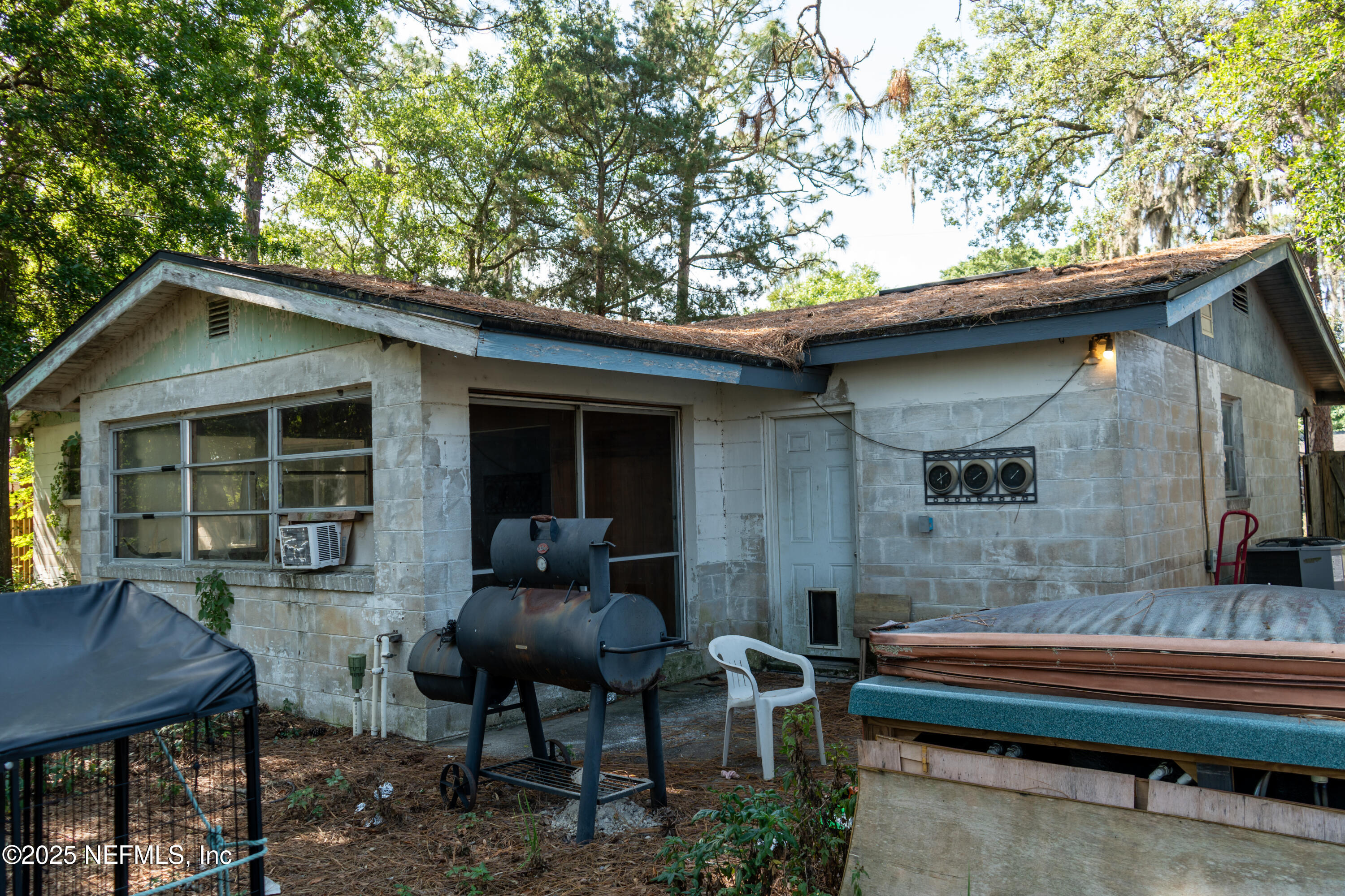 6537 Simca Drive Jacksonville, FL 32277 - Photo 14 of 26 a backyard of a house with outdoor seating