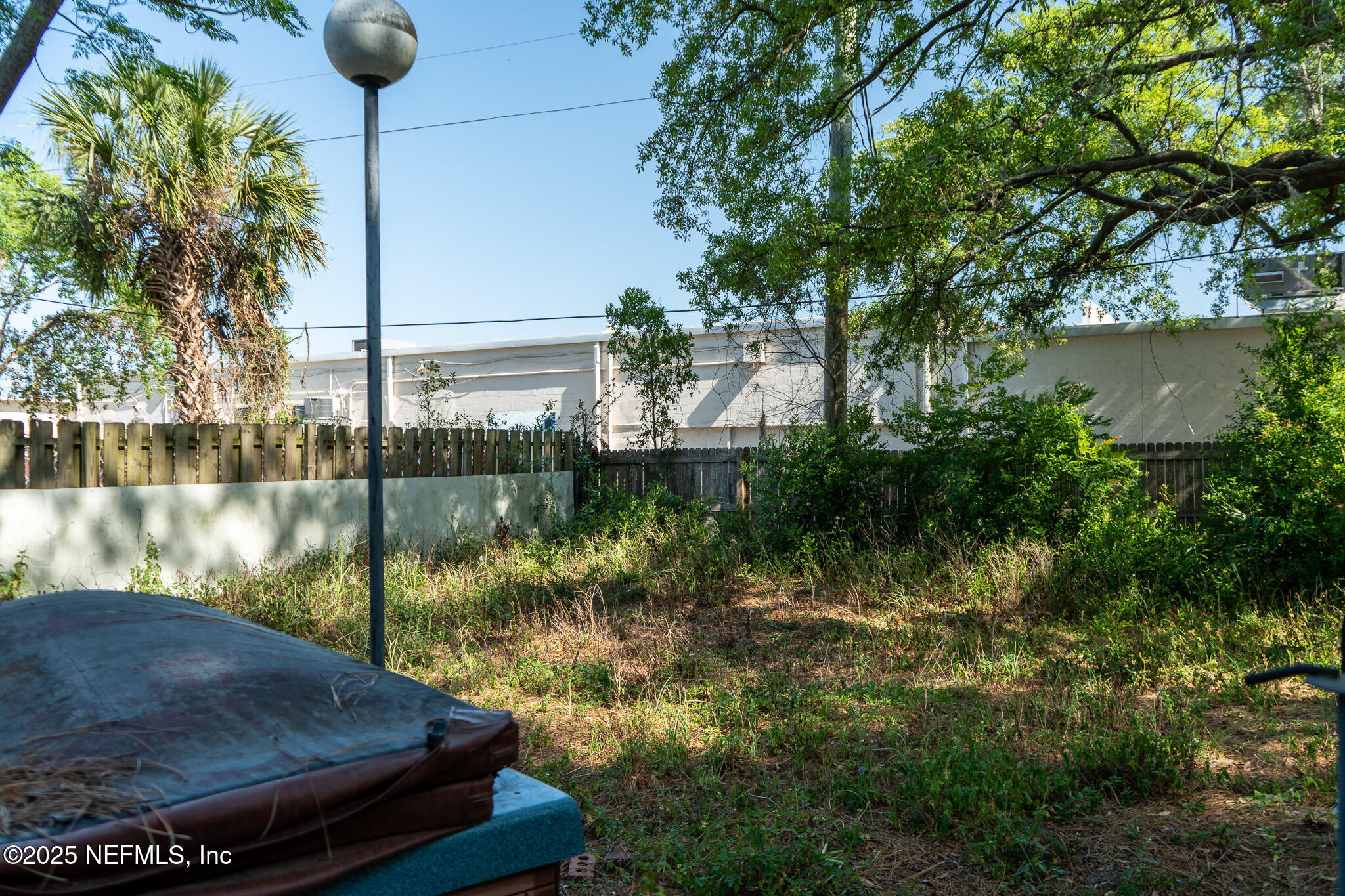 6537 Simca Drive Jacksonville, FL 32277 - Photo 17 of 26 a view of a lake in middle of the house
