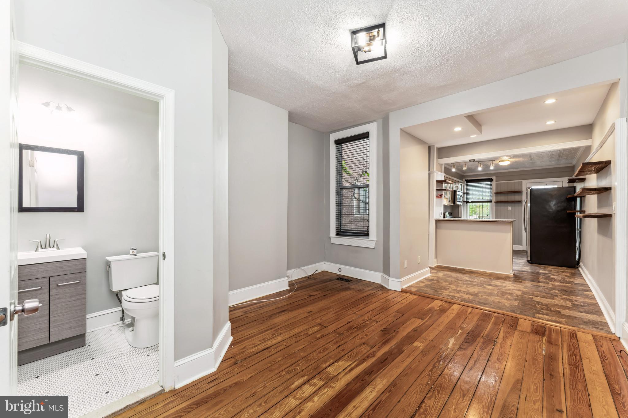 3903 Roland Avenue Baltimore, MD 21211 - Photo 6 of 29 Half Bath/Dining Room to Kitchen