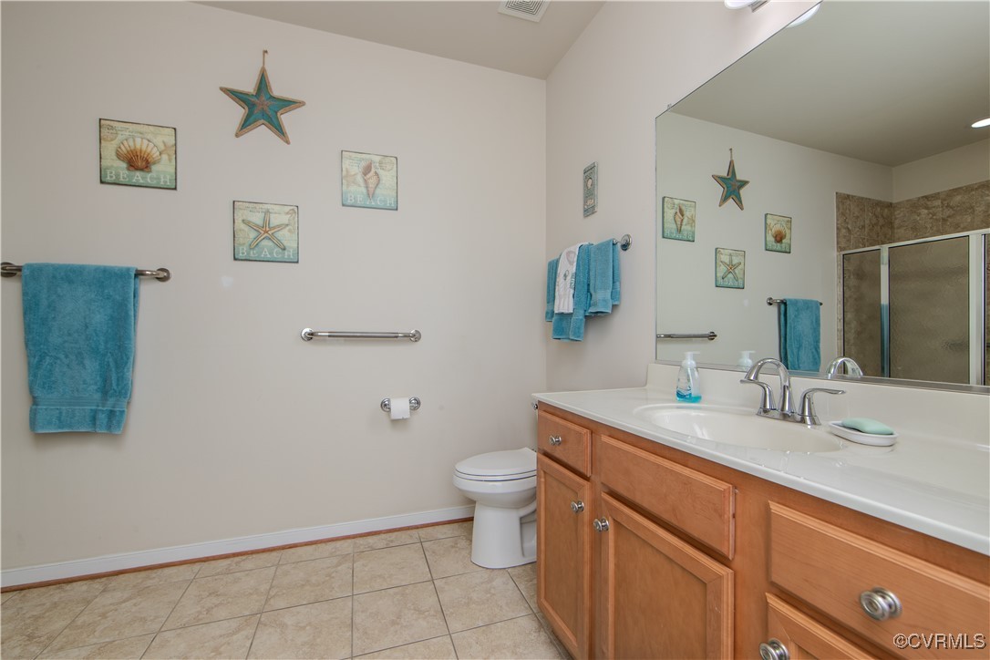 12114 Blossom Point Road Chester, VA 23831 - Photo 11 of 15 Bathroom with vanity, tile patterned floors, toile