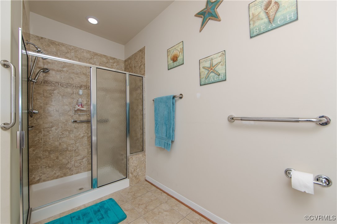 12114 Blossom Point Road Chester, VA 23831 - Photo 12 of 15 Bathroom featuring walk in shower and tile pattern