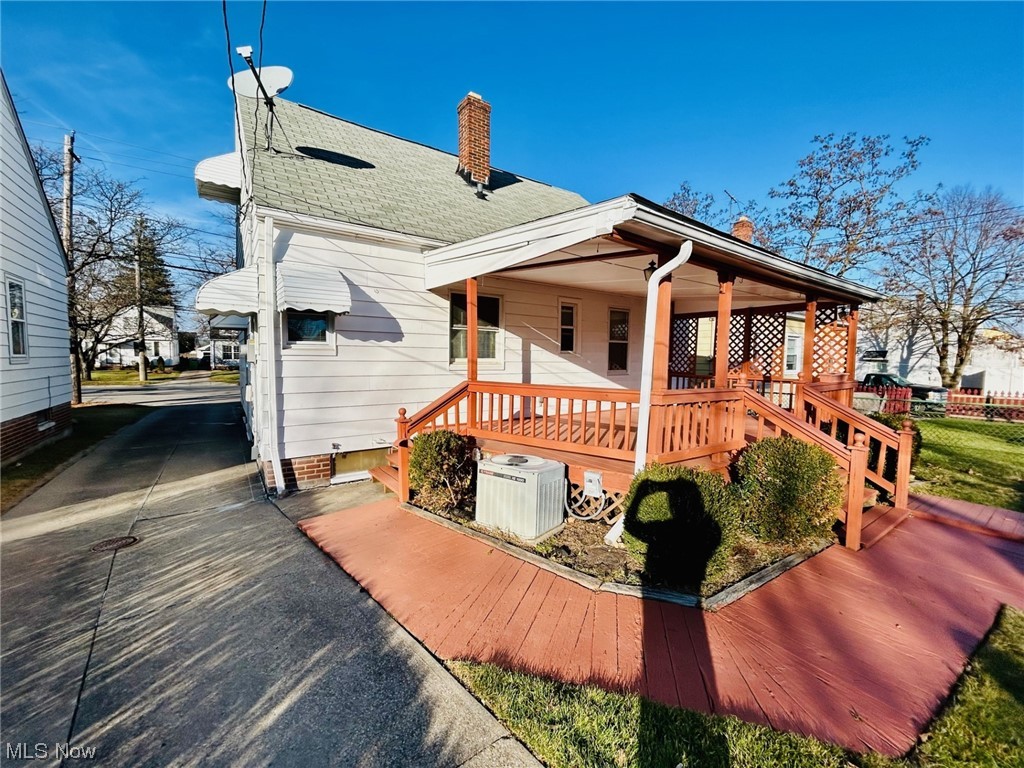13414 Rockside Road Garfield Heights, OH 44125 - Photo 21 of 25 View of front of home with a porch and central AC unit