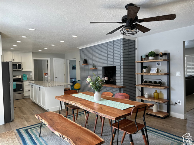 702 North 100 West Logan, UT 84321 - Photo 21 of 58 Dining space with recessed lighting, baseboards, a textured ceiling, ceiling fan, and light wood-style flooring