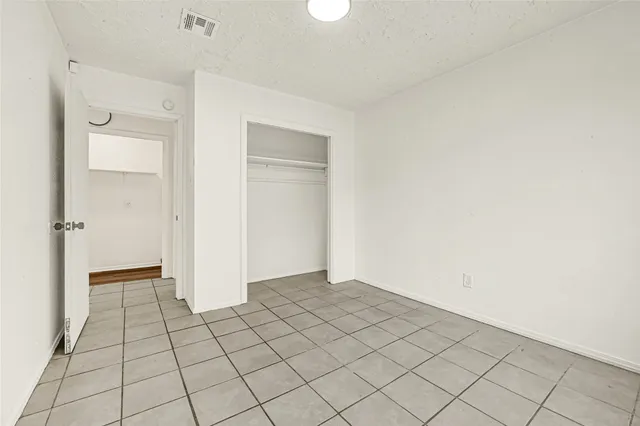 a bathroom with a bathtub and toilet