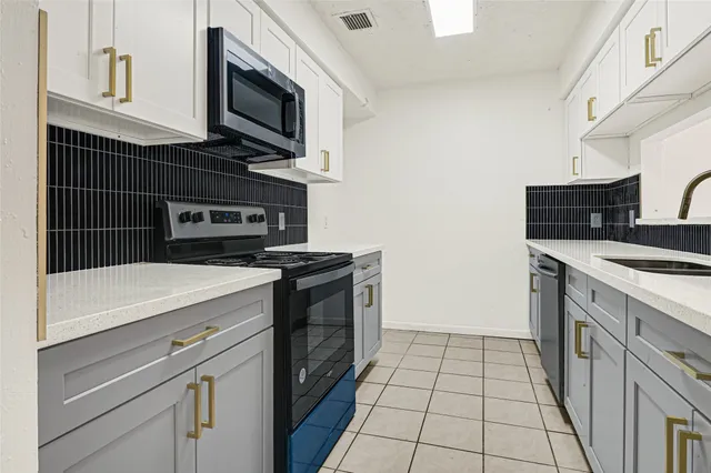 a kitchen with a stove and a microwave