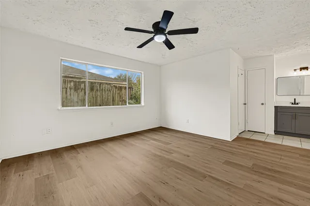 a bathroom with a double vanity sink and mirror
